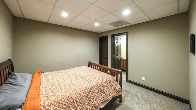 bedroom with light carpet, a drop ceiling, recessed lighting, and baseboards