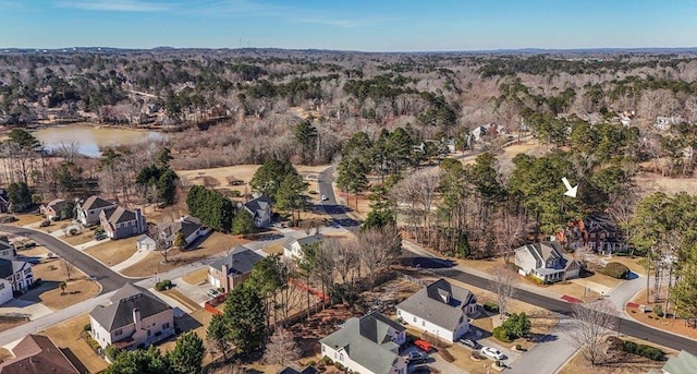 birds eye view of property with a residential view and a water view