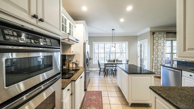 kitchen featuring light tile patterned floors, stainless steel appliances, ornamental molding, a healthy amount of sunlight, and under cabinet range hood