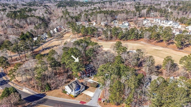 aerial view with a wooded view
