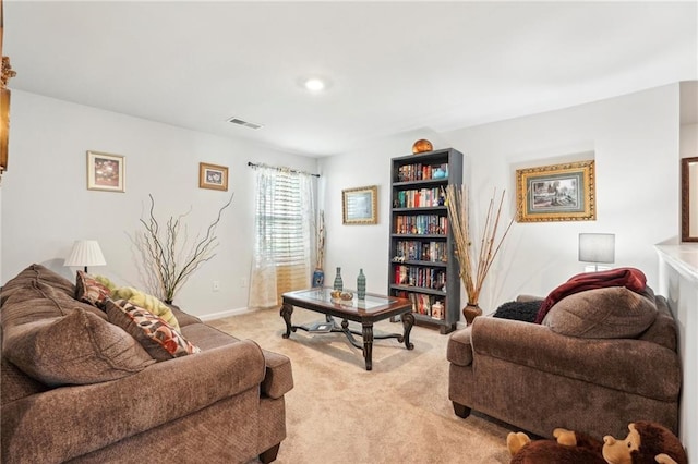 living room with visible vents and light colored carpet