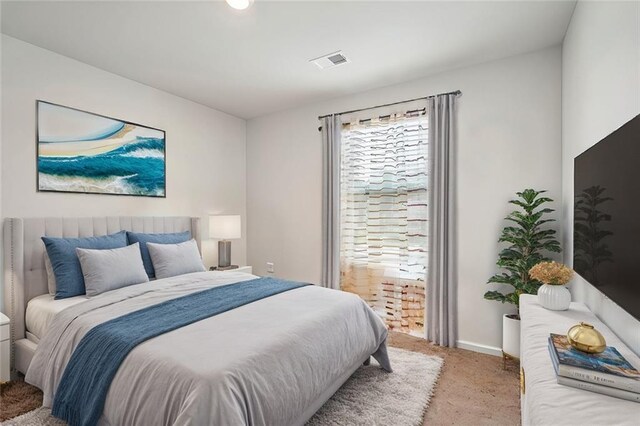 bedroom featuring carpet, visible vents, and baseboards