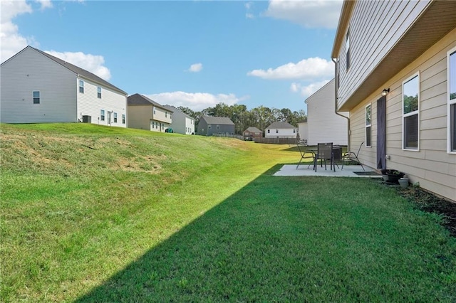 view of yard featuring a patio area and a residential view