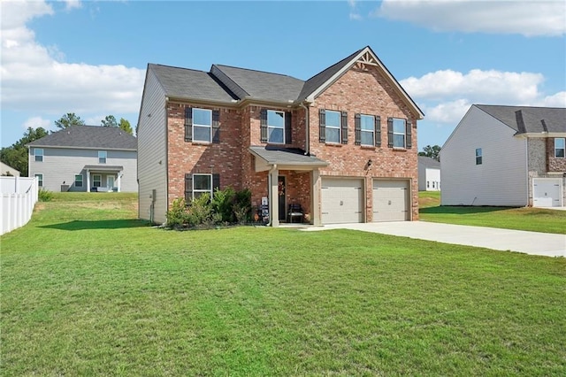 view of front of home featuring a garage and a front lawn