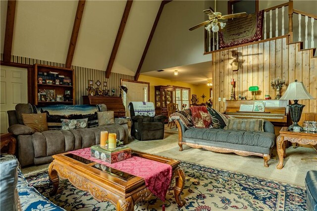 living room with high vaulted ceiling, carpet floors, and ceiling fan