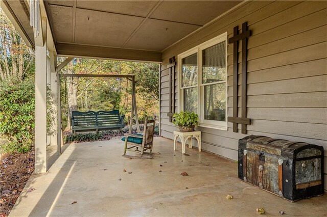 exterior space with a patio area and a carport