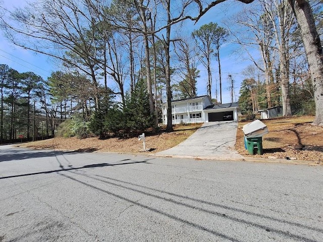 view of front of property with a garage and concrete driveway