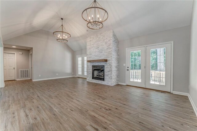 14 Brook Valley Ct SW, Rome, GA 30165 - unfurnished living room featuring a chandelier, plenty of natural light, wood finished floors, and high vaulted ceiling