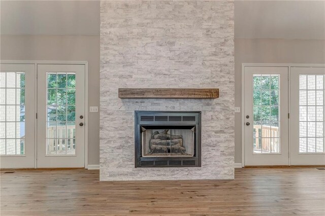 14 Brook Valley Ct SW, Rome, GA 30165 - unfurnished living room with wood finished floors, a fireplace, and baseboards