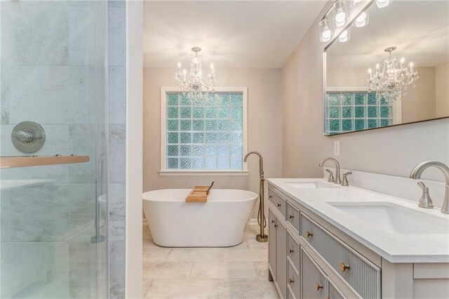 14 Brook Valley Ct SW, Rome, GA 30165 - bathroom featuring a chandelier, double vanity, a freestanding bath, and a shower stall