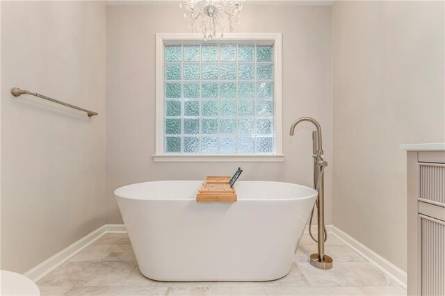 14 Brook Valley Ct SW, Rome, GA 30165 - bathroom featuring a soaking tub, plenty of natural light, and baseboards