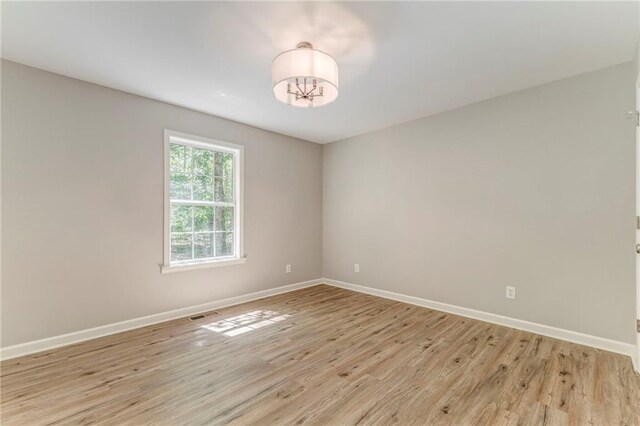 14 Brook Valley Ct SW, Rome, GA 30165 - spare room featuring baseboards and light wood finished floors