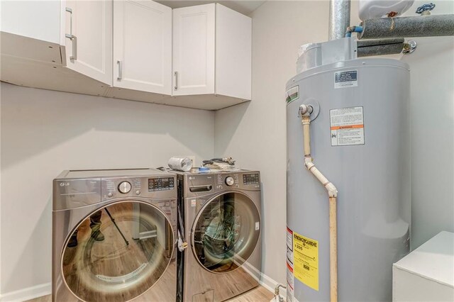 14 Brook Valley Ct SW, Rome, GA 30165 - laundry room with water heater, cabinet space, separate washer and dryer, and baseboards