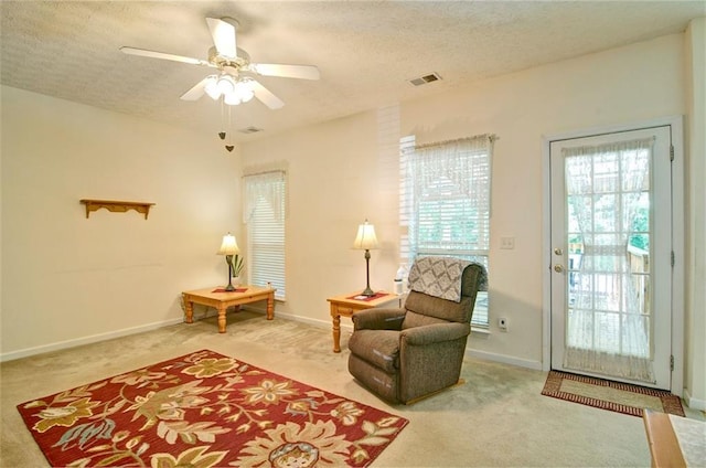 809 Longbranch Ln, Douglasville, GA 30134 - sitting room featuring carpet flooring, a textured ceiling, a ceiling fan, and baseboards