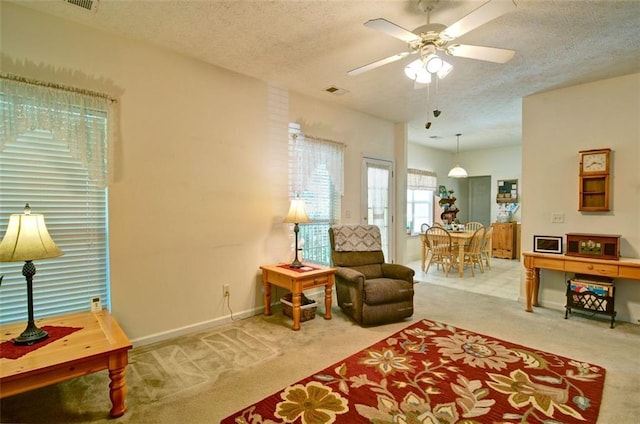 809 Longbranch Ln, Douglasville, GA 30134 - living area featuring carpet flooring, a textured ceiling, ceiling fan, and baseboards