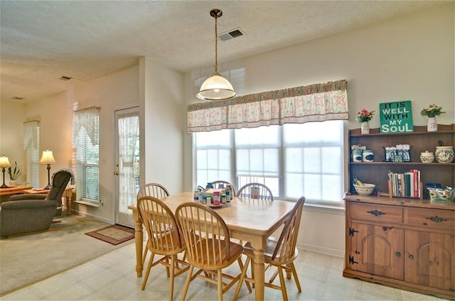 809 Longbranch Ln, Douglasville, GA 30134 - dining space featuring a textured ceiling and baseboards