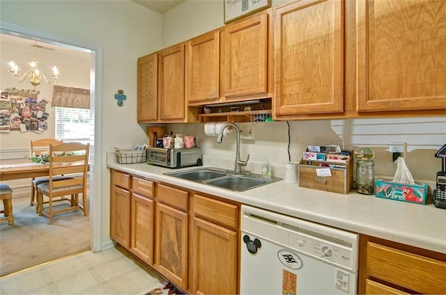 809 Longbranch Ln, Douglasville, GA 30134 - kitchen with white dishwasher, a sink, light countertops, a chandelier, and light flooring
