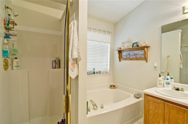 809 Longbranch Ln, Douglasville, GA 30134 - bathroom featuring a stall shower, vanity, a bath, and a textured ceiling