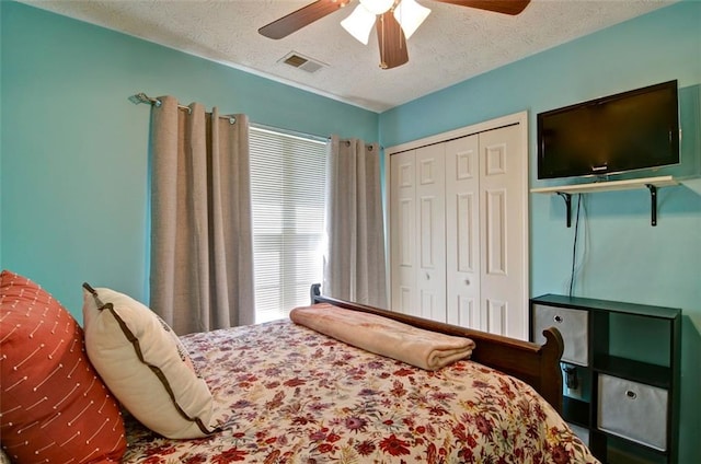 809 Longbranch Ln, Douglasville, GA 30134 - bedroom with a textured ceiling, ceiling fan, and a closet