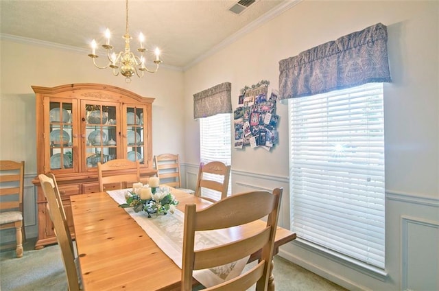 809 Longbranch Ln, Douglasville, GA 30134 - carpeted dining room with a chandelier, crown molding, and a wainscoted wall