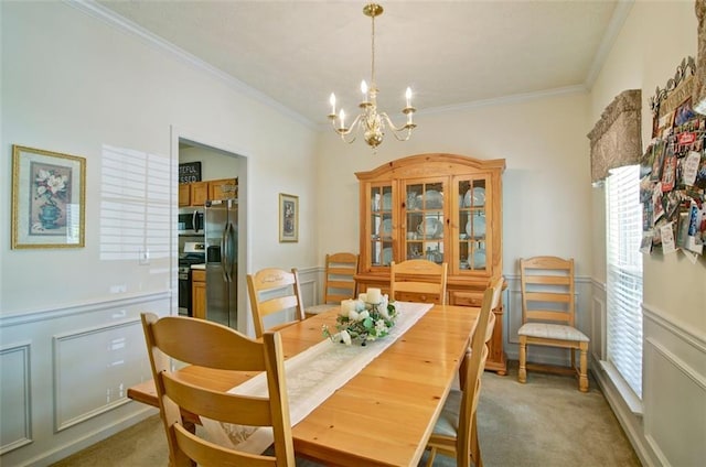 809 Longbranch Ln, Douglasville, GA 30134 - dining room with ornamental molding, light colored carpet, and a chandelier