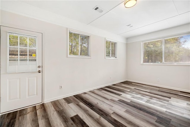 spare room featuring hardwood / wood-style floors