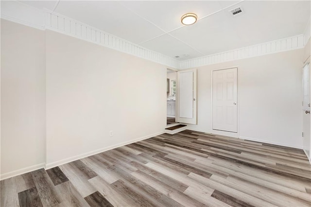 unfurnished room featuring hardwood / wood-style flooring