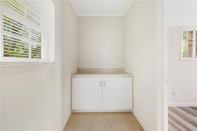 interior details featuring hardwood / wood-style flooring and crown molding