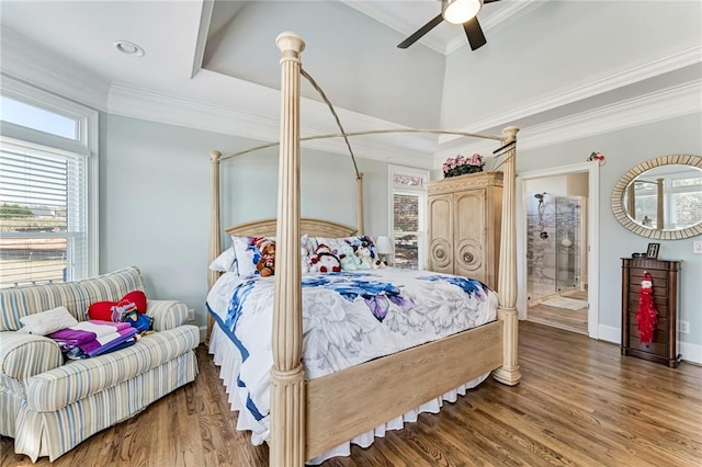 bedroom with ceiling fan, hardwood / wood-style flooring, crown molding, and ensuite bath