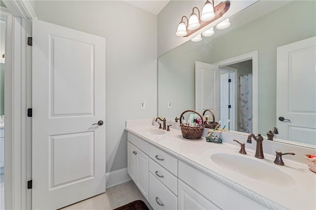 bathroom with vanity and tile patterned floors