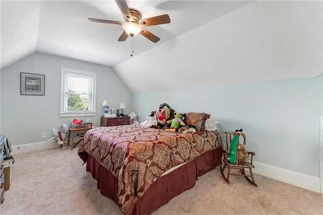 carpeted bedroom featuring lofted ceiling and ceiling fan