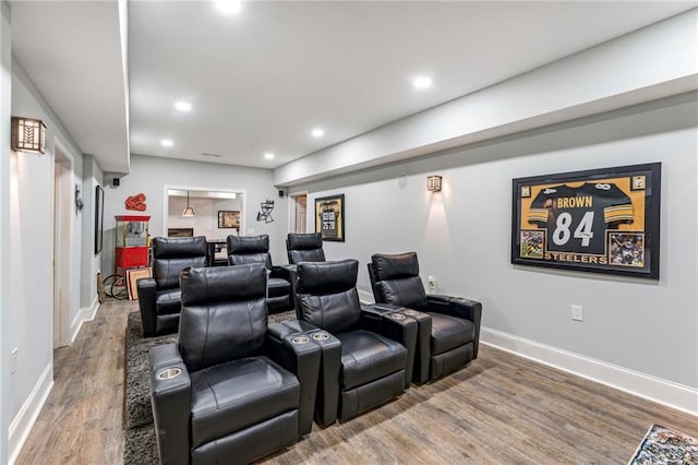 cinema room with hardwood / wood-style floors