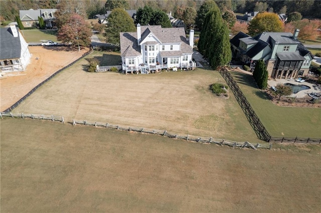 birds eye view of property with a rural view