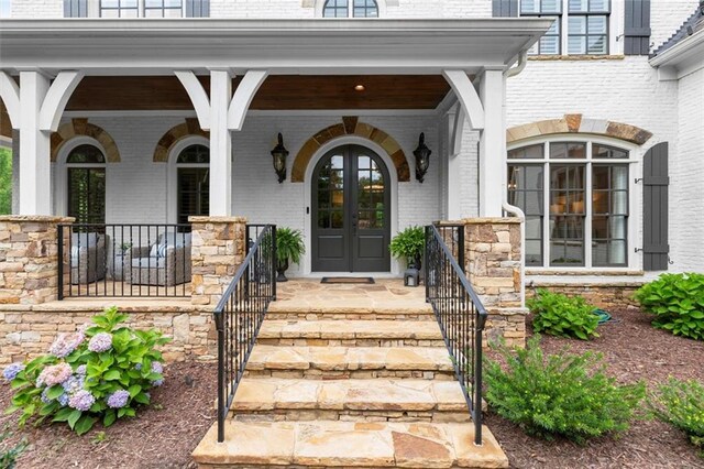 15910 Meadow King Way, Milton, GA 30004 - view of exterior entry featuring brick siding and a porch