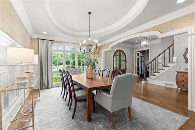 15910 Meadow King Way, Milton, GA 30004 - dining room featuring plenty of natural light, a chandelier, crown molding, stairs, and wood finished floors