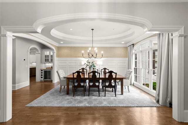 15910 Meadow King Way, Milton, GA 30004 - dining room with wine cooler, plenty of natural light, a chandelier, wood finished floors, and a decorative wall