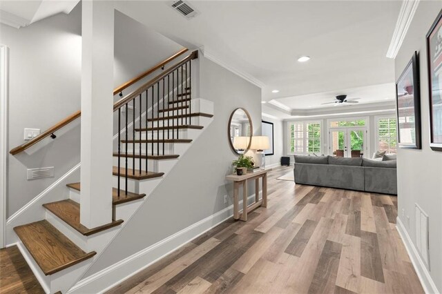 15910 Meadow King Way, Milton, GA 30004 - stairs with crown molding, recessed lighting, wood finished floors, a ceiling fan, and french doors