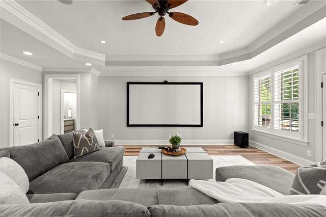 15910 Meadow King Way, Milton, GA 30004 - home theater featuring a raised ceiling, wood finished floors, a ceiling fan, crown molding, and recessed lighting