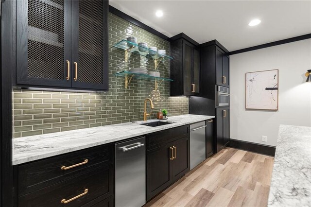 15910 Meadow King Way, Milton, GA 30004 - kitchen featuring stainless steel dishwasher, light wood-style flooring, backsplash, light stone counters, and recessed lighting