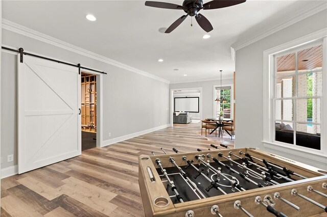 15910 Meadow King Way, Milton, GA 30004 - kitchen featuring wood finished floors, a ceiling fan, a barn door, recessed lighting, and crown molding