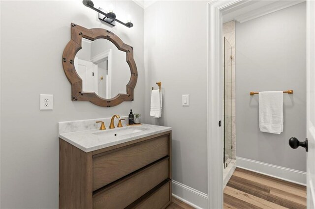 15910 Meadow King Way, Milton, GA 30004 - bathroom featuring vanity, a stall shower, and wood finished floors
