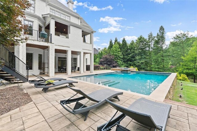 15910 Meadow King Way, Milton, GA 30004 - view of pool featuring a patio area and a pool with connected hot tub