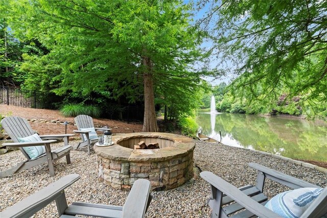 15910 Meadow King Way, Milton, GA 30004 - view of patio with an outdoor fire pit and a water view