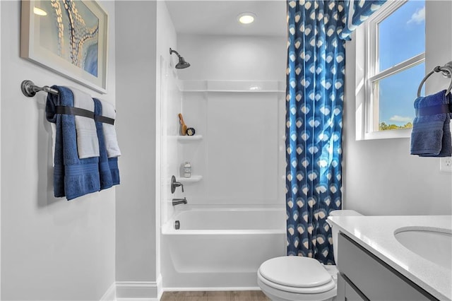 full bath featuring shower / bath combo, vanity, and toilet