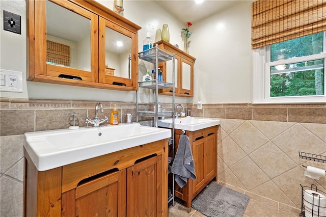 1438 Salem Dr, Alpharetta, GA 30009 - bathroom with tile walls, two vanities, a wainscoted wall, and tile patterned flooring