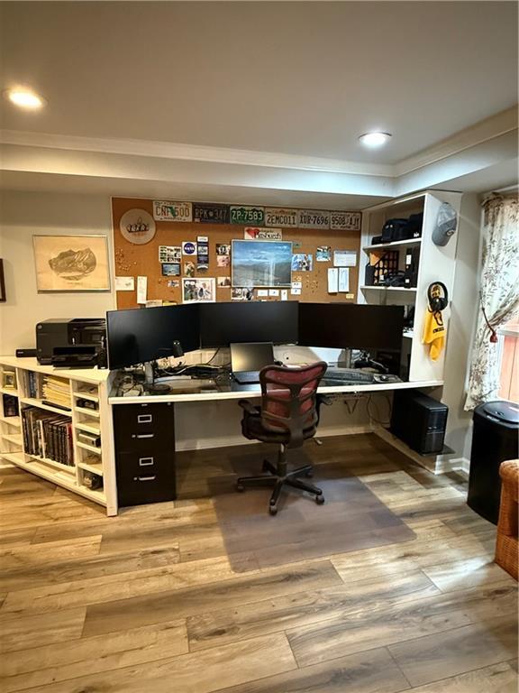 1438 Salem Dr, Alpharetta, GA 30009 - office with wood finished floors, crown molding, built in desk, a raised ceiling, and recessed lighting