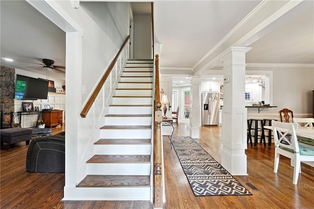 1438 Salem Dr, Alpharetta, GA 30009 - stairway featuring ornate columns, a ceiling fan, wood finished floors, and crown molding