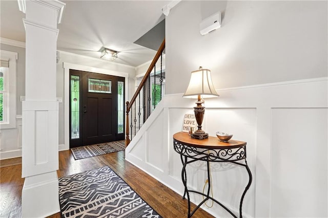 1438 Salem Dr, Alpharetta, GA 30009 - foyer entrance with decorative columns, a decorative wall, wood finished floors, a wainscoted wall, and ornamental molding
