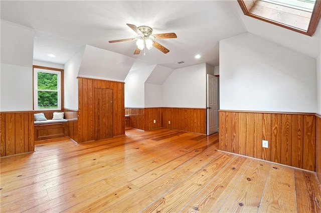 1438 Salem Dr, Alpharetta, GA 30009 - additional living space featuring vaulted ceiling, a wainscoted wall, light wood-type flooring, wood walls, and a ceiling fan