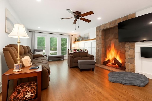 1438 Salem Dr, Alpharetta, GA 30009 - living room with a stone fireplace, wood finished floors, a ceiling fan, and recessed lighting